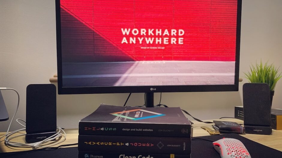 black flat screen tv turned on near white remote control