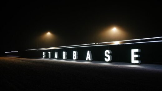 a sign that is lit up in the dark