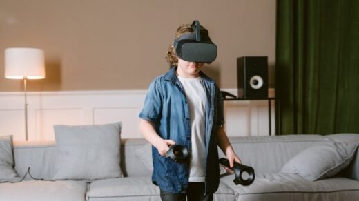 Young boy enjoying virtual reality gaming with VR headset and controllers indoors.