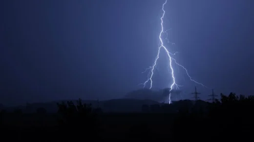 Dramatic lightning bolt striking during a stormy night. Perfect for nature and weather themes.