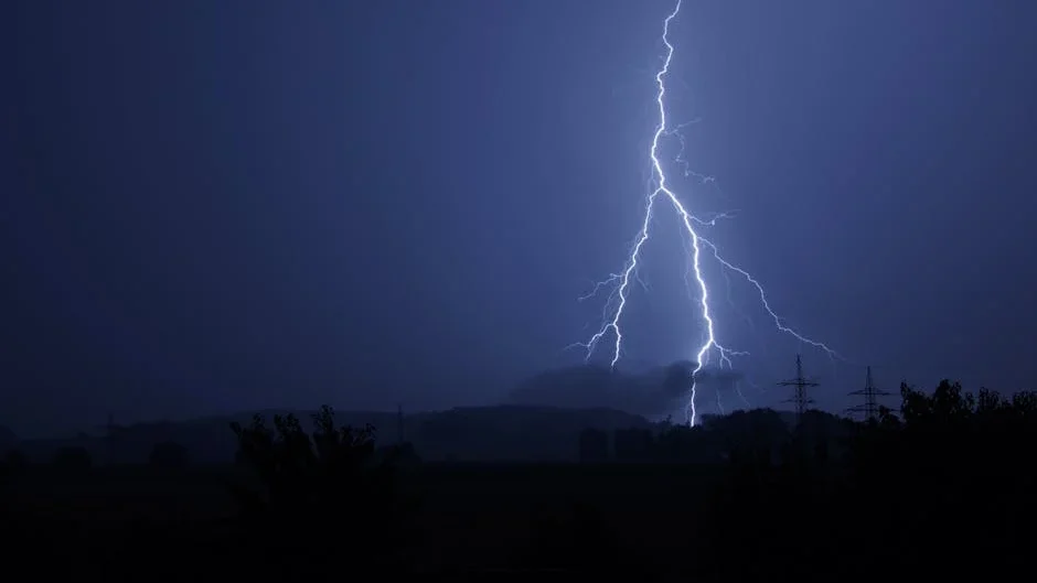 Dramatic lightning bolt striking during a stormy night. Perfect for nature and weather themes.