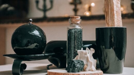 Collection of magic items with timber round shaped board with granite stone on blurred background