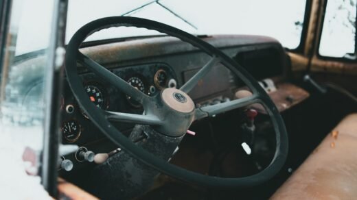 black steering wheel in close up photography