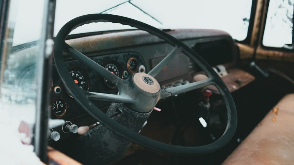 black steering wheel in close up photography