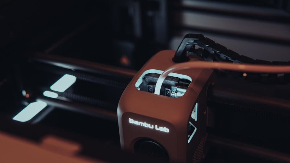 Detailed view of a 3D printer mechanism in a dark setting, highlighting technology.