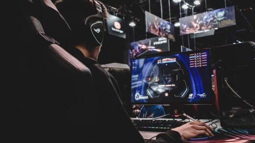 person sitting on gaming chair while playing video game