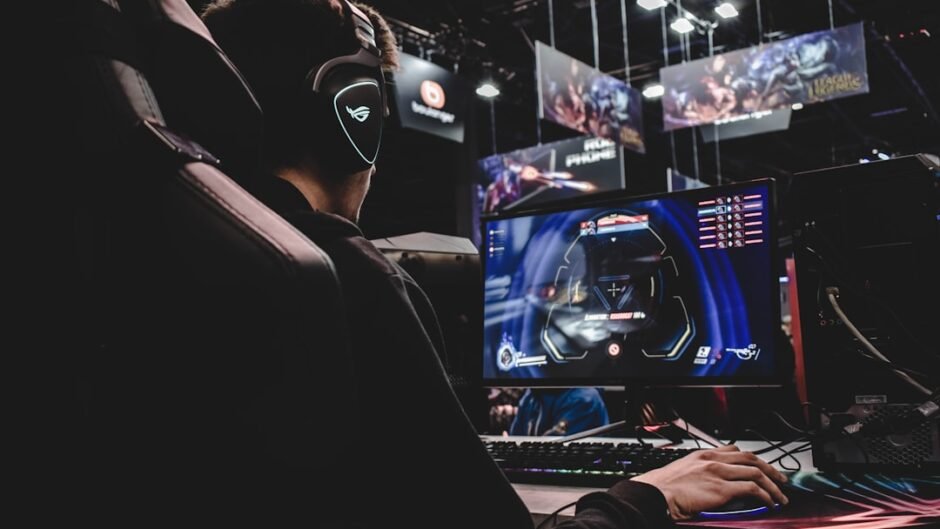 person sitting on gaming chair while playing video game