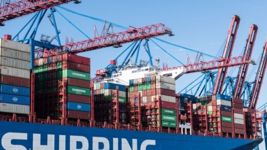 Shipping containers and cranes at Hamburg port showcasing global trade.