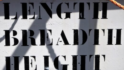 a close up of a sign with a rope attached to it
