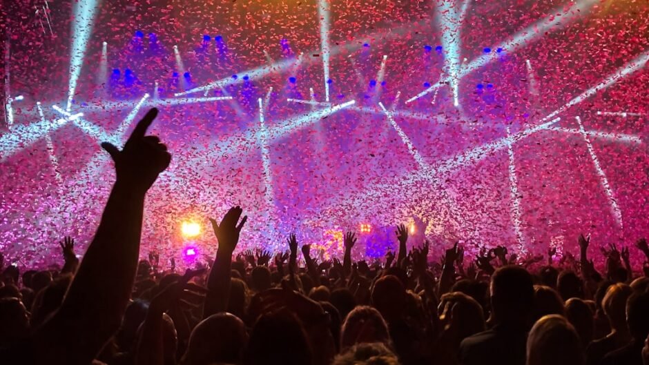crowd raising their hands