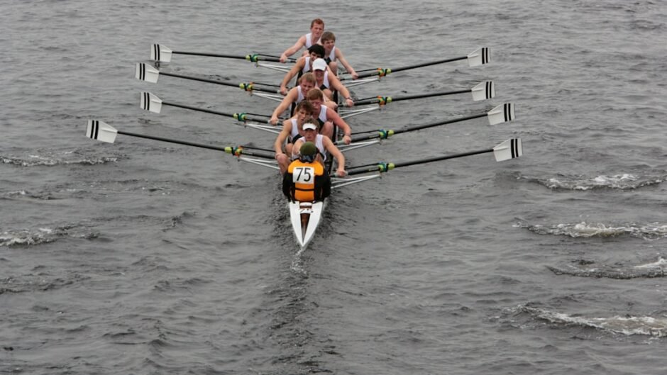 a group of people on a boat in the water