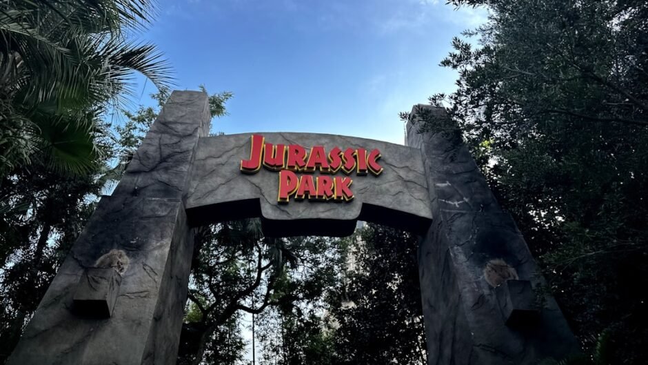 a sign for a park with a sky background