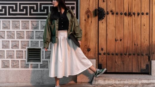 a woman standing in front of a wooden door
