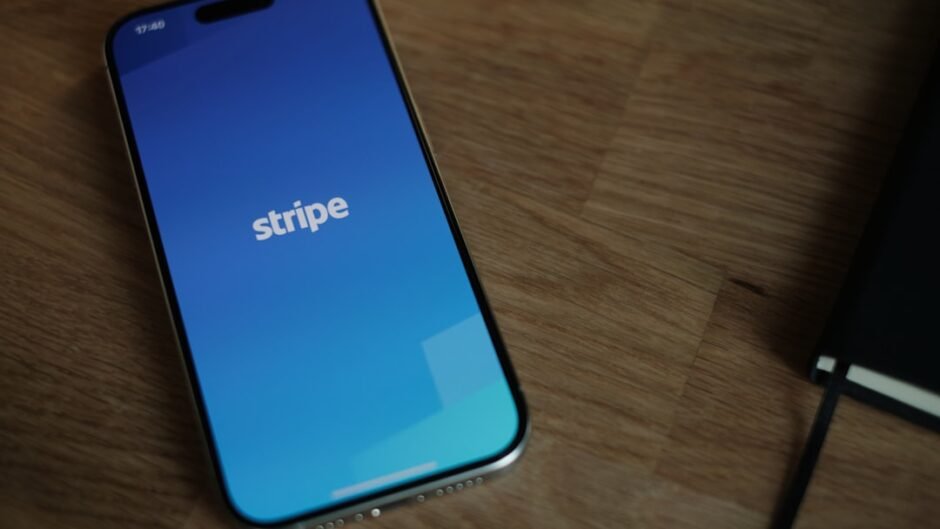 A cell phone sitting on top of a wooden table