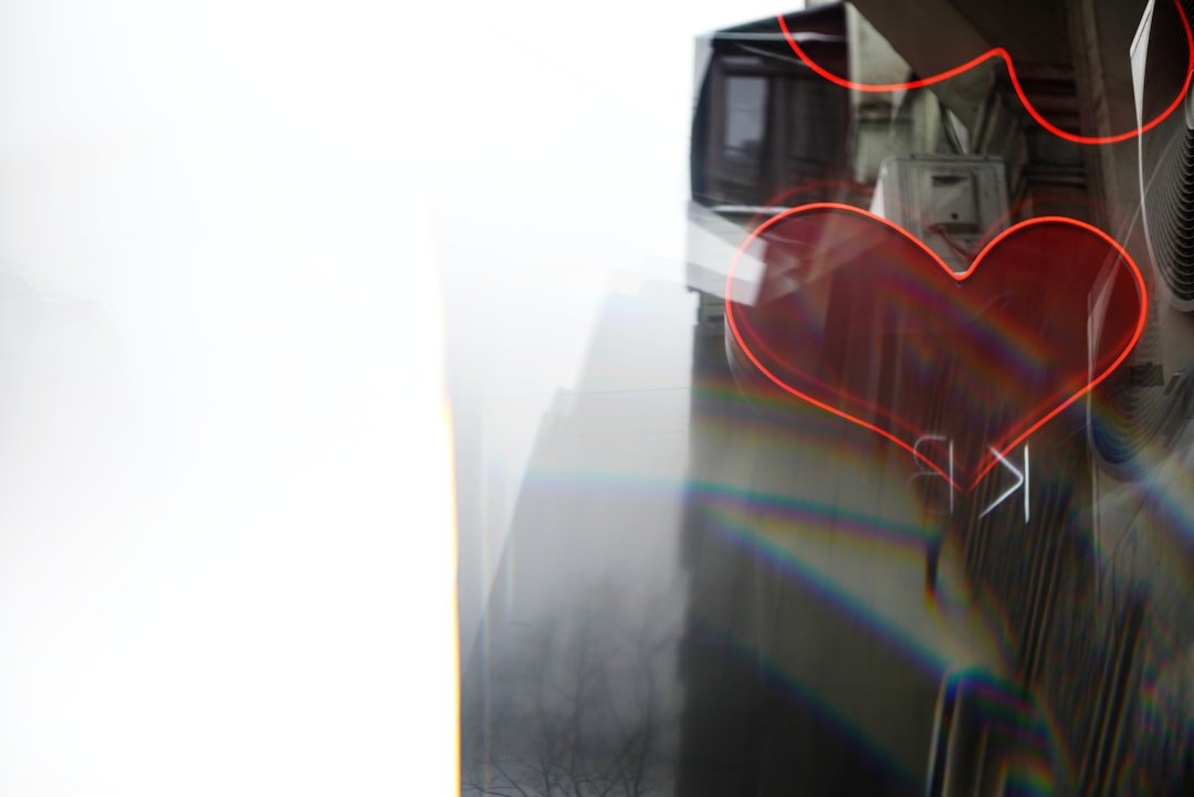 Red heart shape overlay on a blurry background